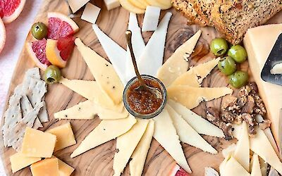 Luxury cheese board with Henri Willig family line cheeses and homemade pear balsamic jam