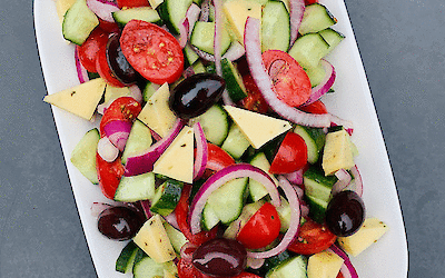 Making your own Greek salad with Tzatziki cheese